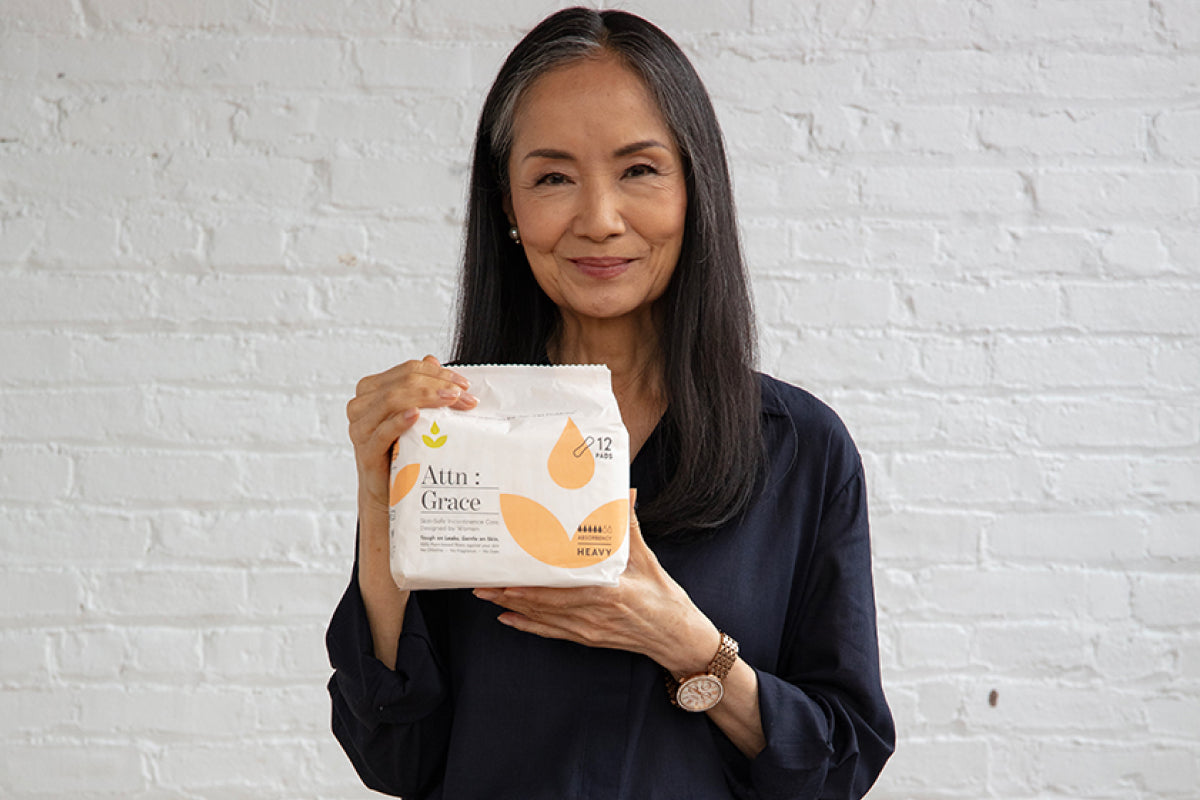 woman with dark skin standing wearing dark underwear bottoms