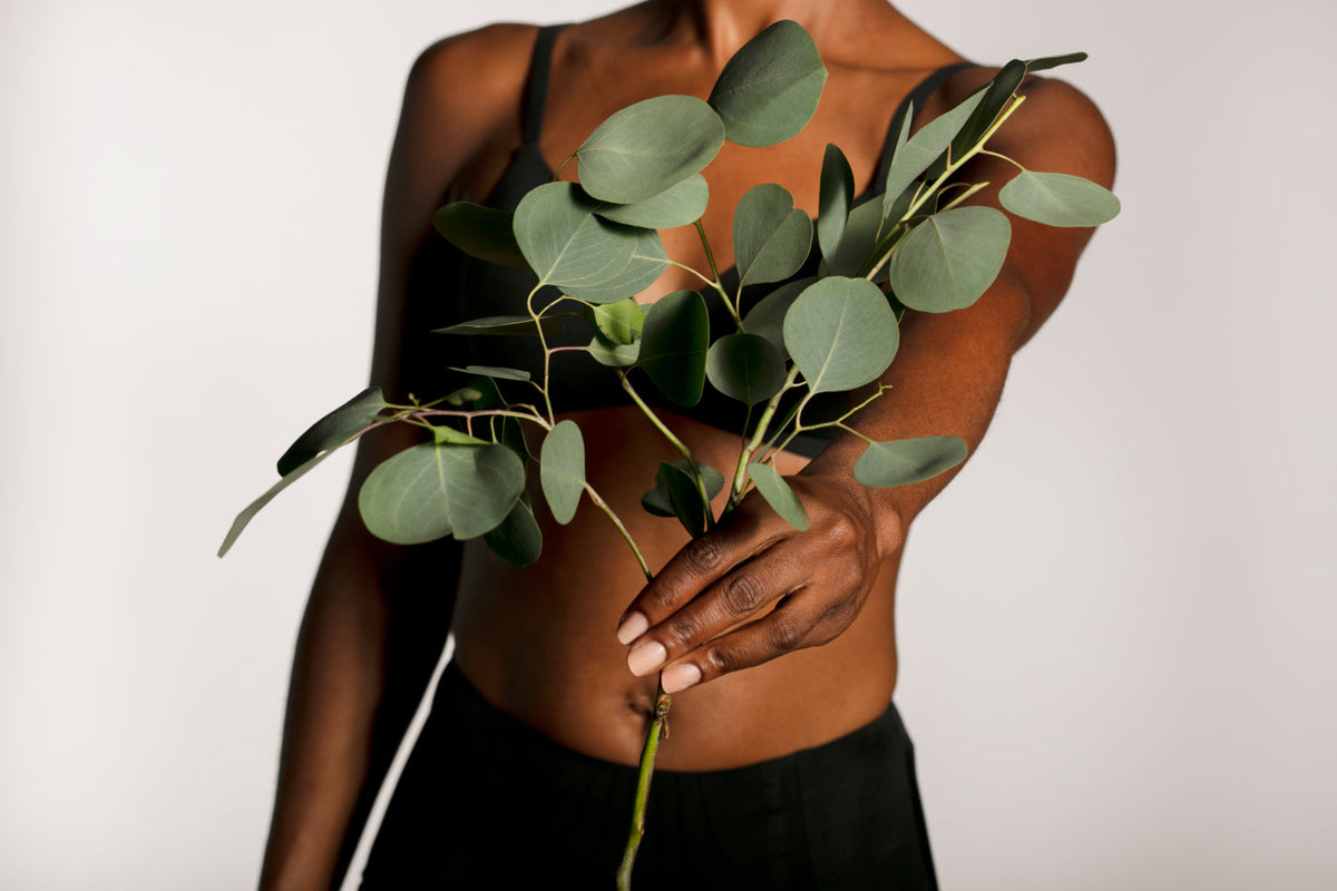 woman holding a plant