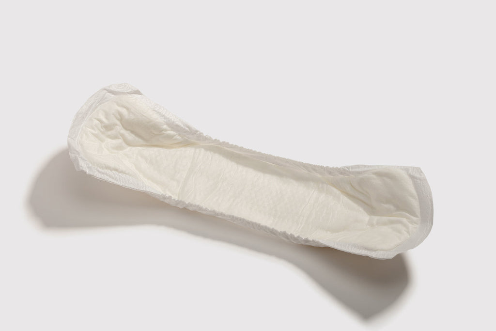 white incontinence pad on a white background