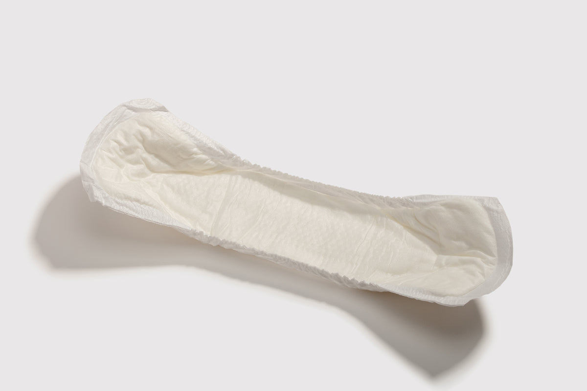 white incontinence pad on a white background