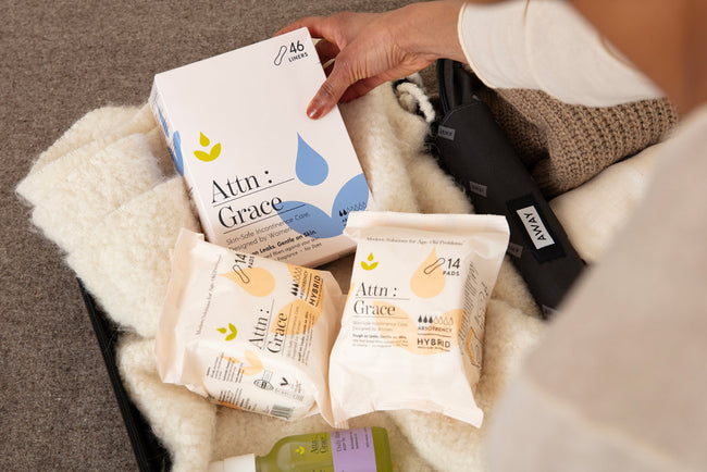 liners, pads and body oil in a suitecase