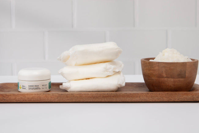 incontinence pads on a tray with barrier cream and cotton wipes