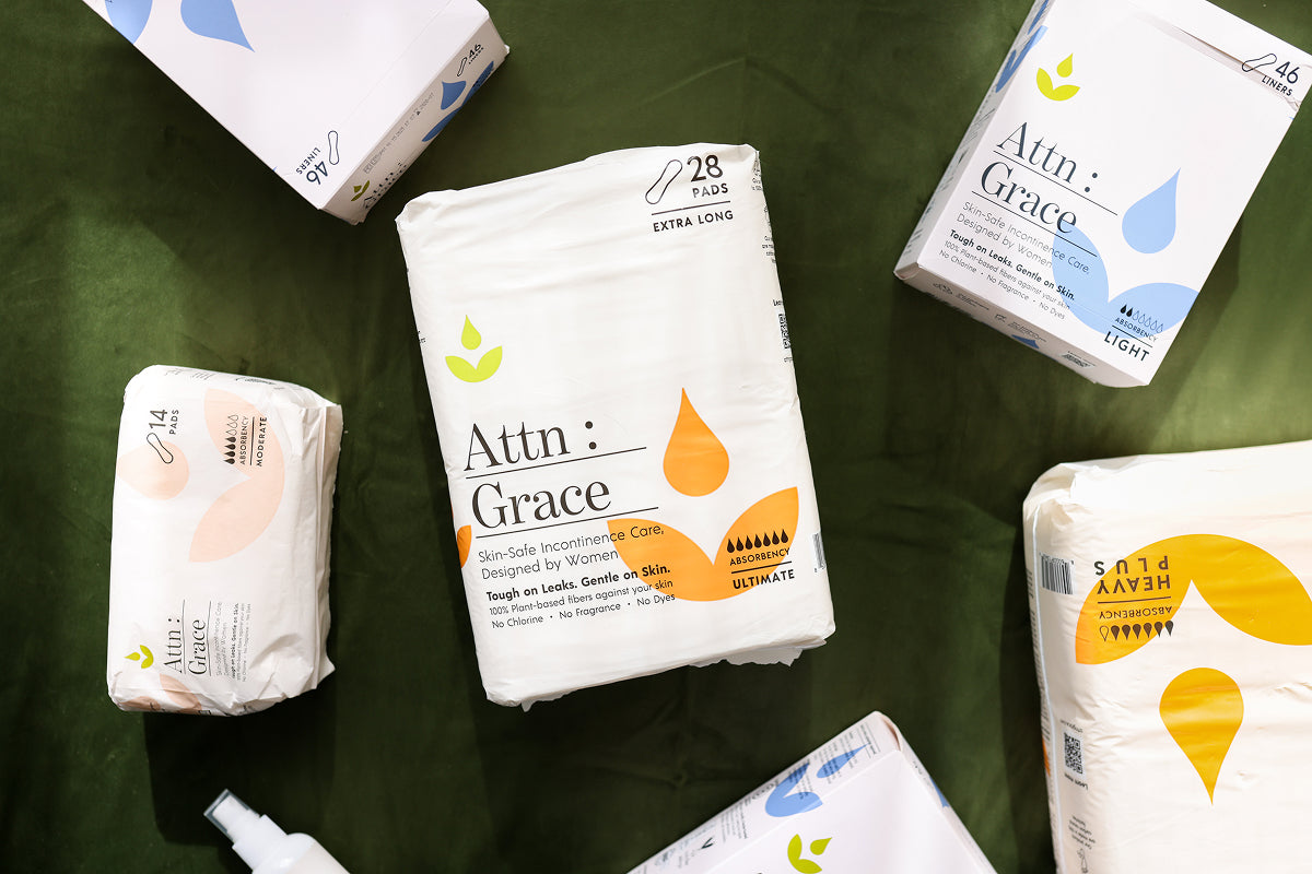 Attn: Grace products laying together on a green background