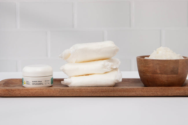 Attn: Grace barrier cream and pads lined up on a wooden serving plate